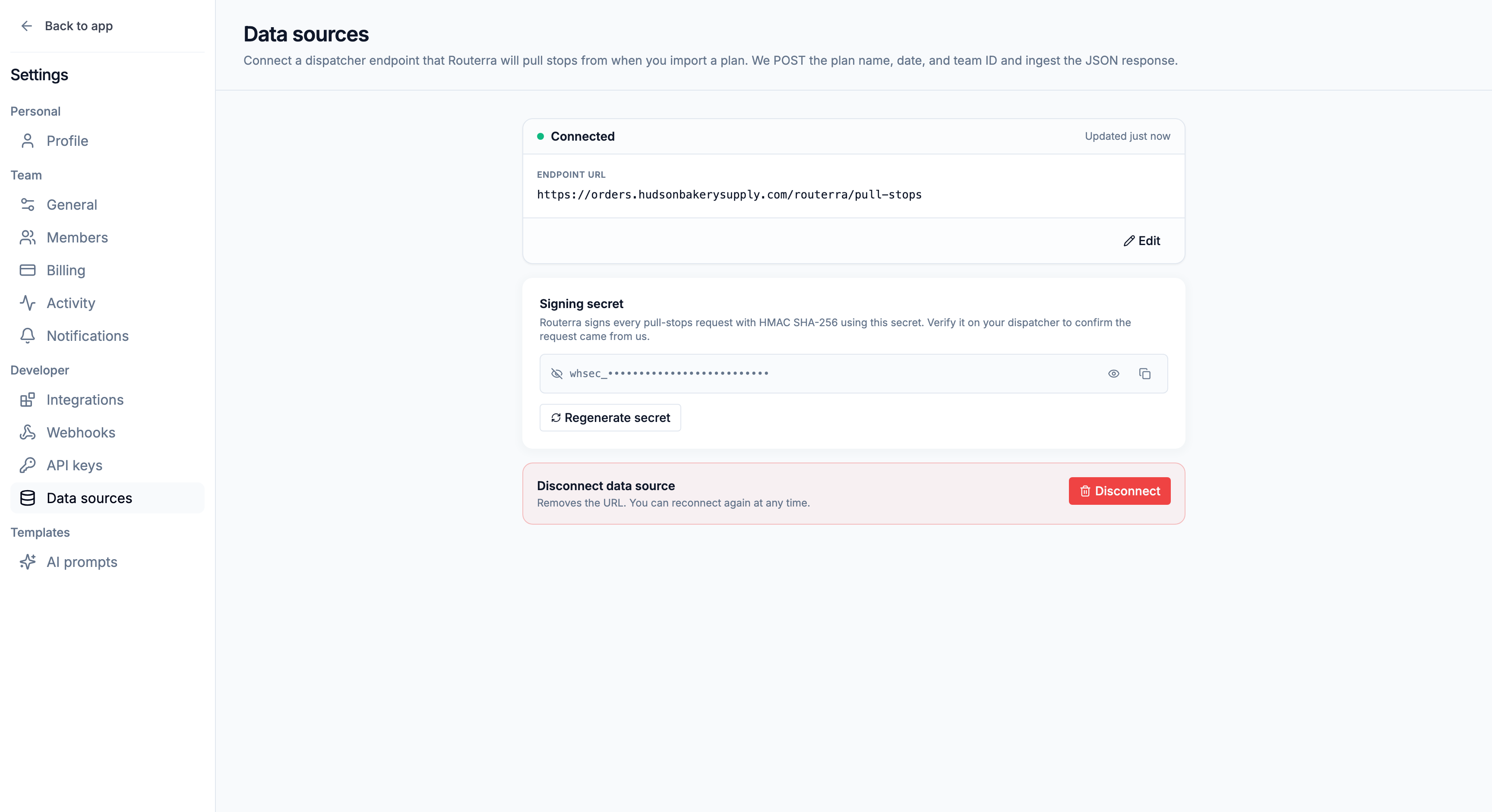 Settings → Data sources with the connected endpoint and its signing secret